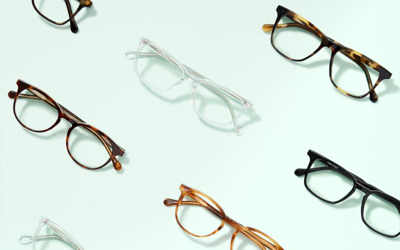 an image of multiple pairs of eyeglasses stacked in diagonal lines